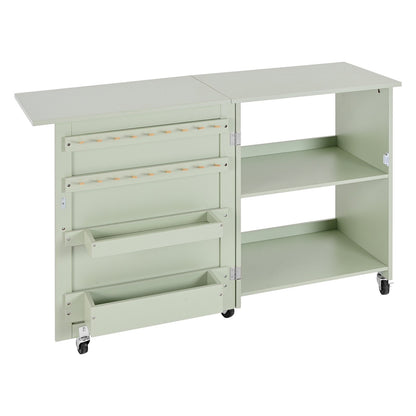 Folding Sewing Table, Multipurpose Sewing Machine Table with Compact Design, Wheels, Wooden Pegs, Storage Trays and Shelf, Magnetic Door Lock, Craft Station and Side Desk for Home, Light Green
